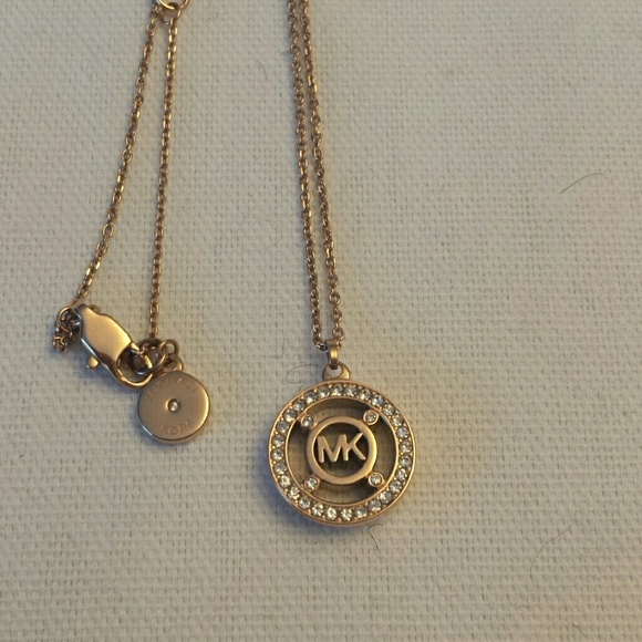 Michael Kors Jewelry - Michael Kors NWOT Rose Gold tone Logo Pendant